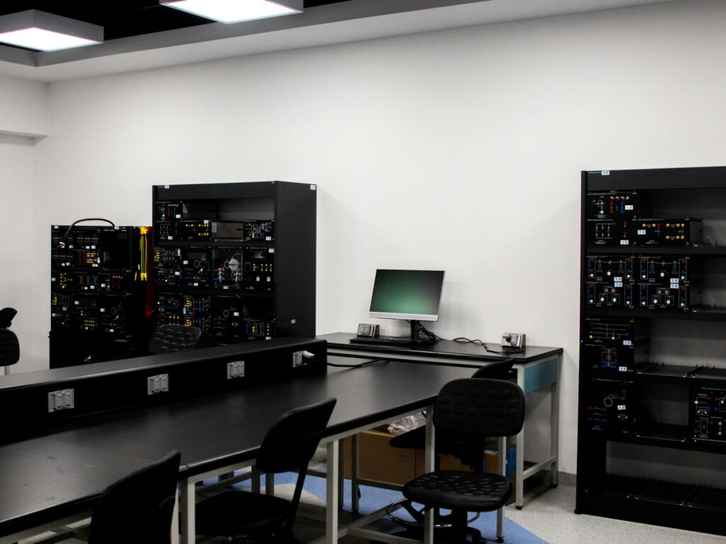 A contemporary electronics lab featuring workstations and technical equipment.